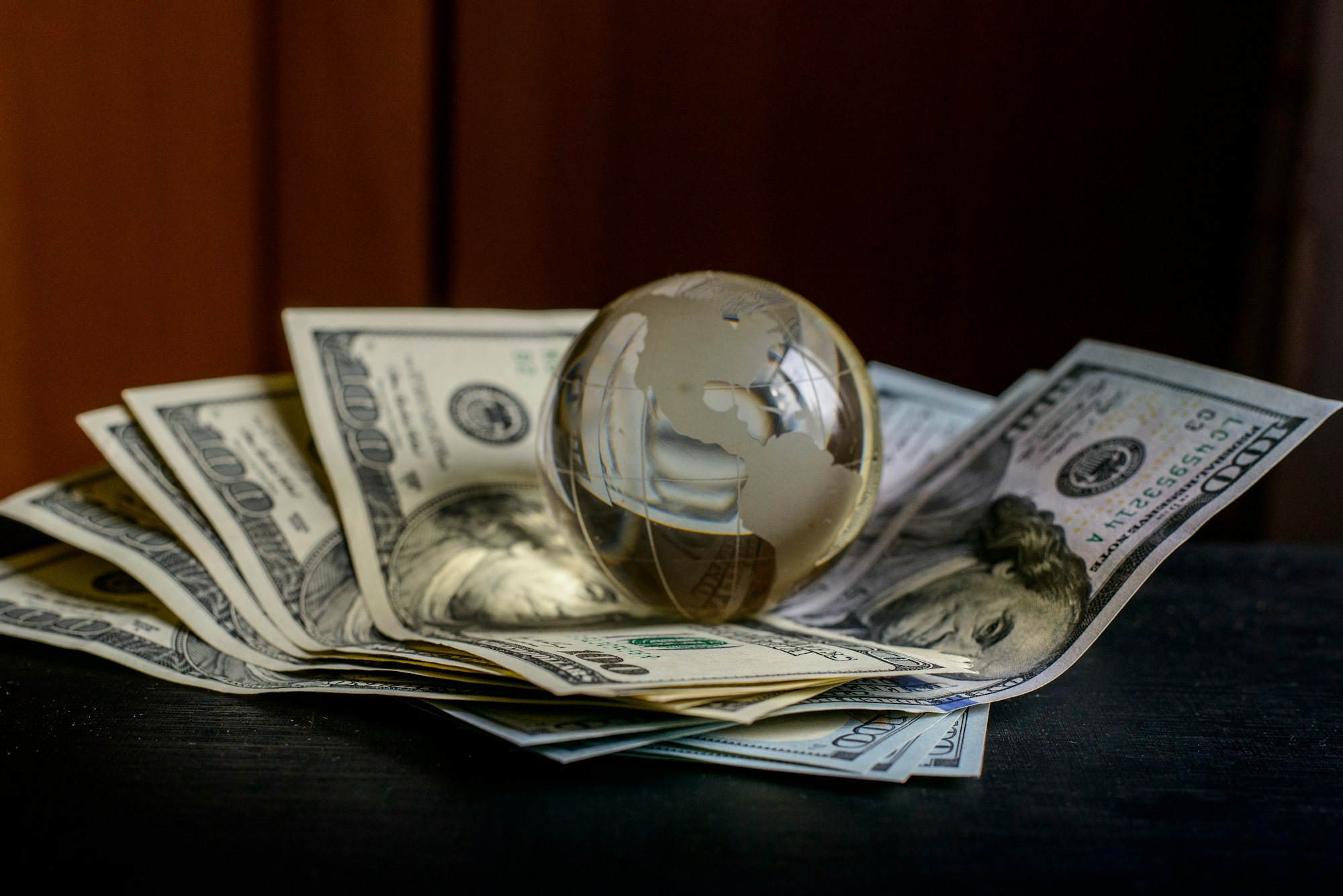 transparent globe on dollars
